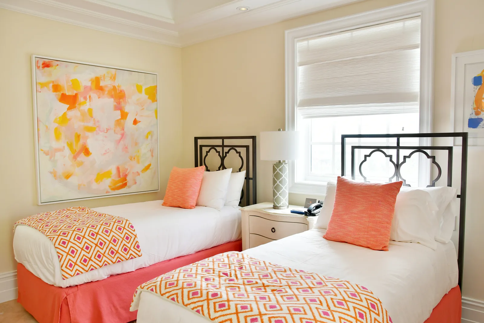 The twin bedroom with coral bedspreads