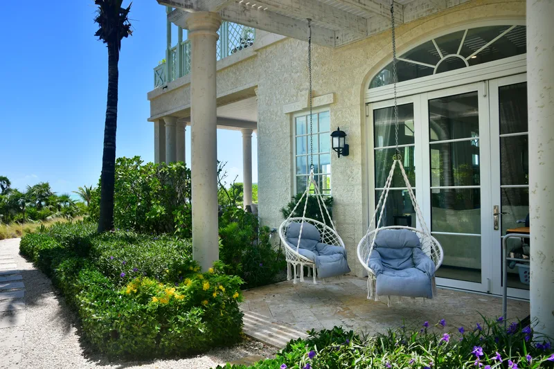 Swing chairs by the entrance of the villa