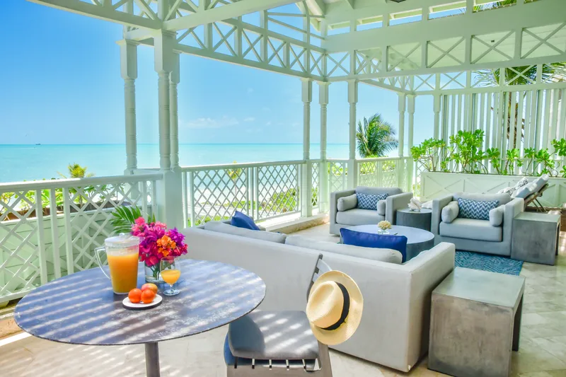 The covered terrace, open to the turquoise water of Long Bay
