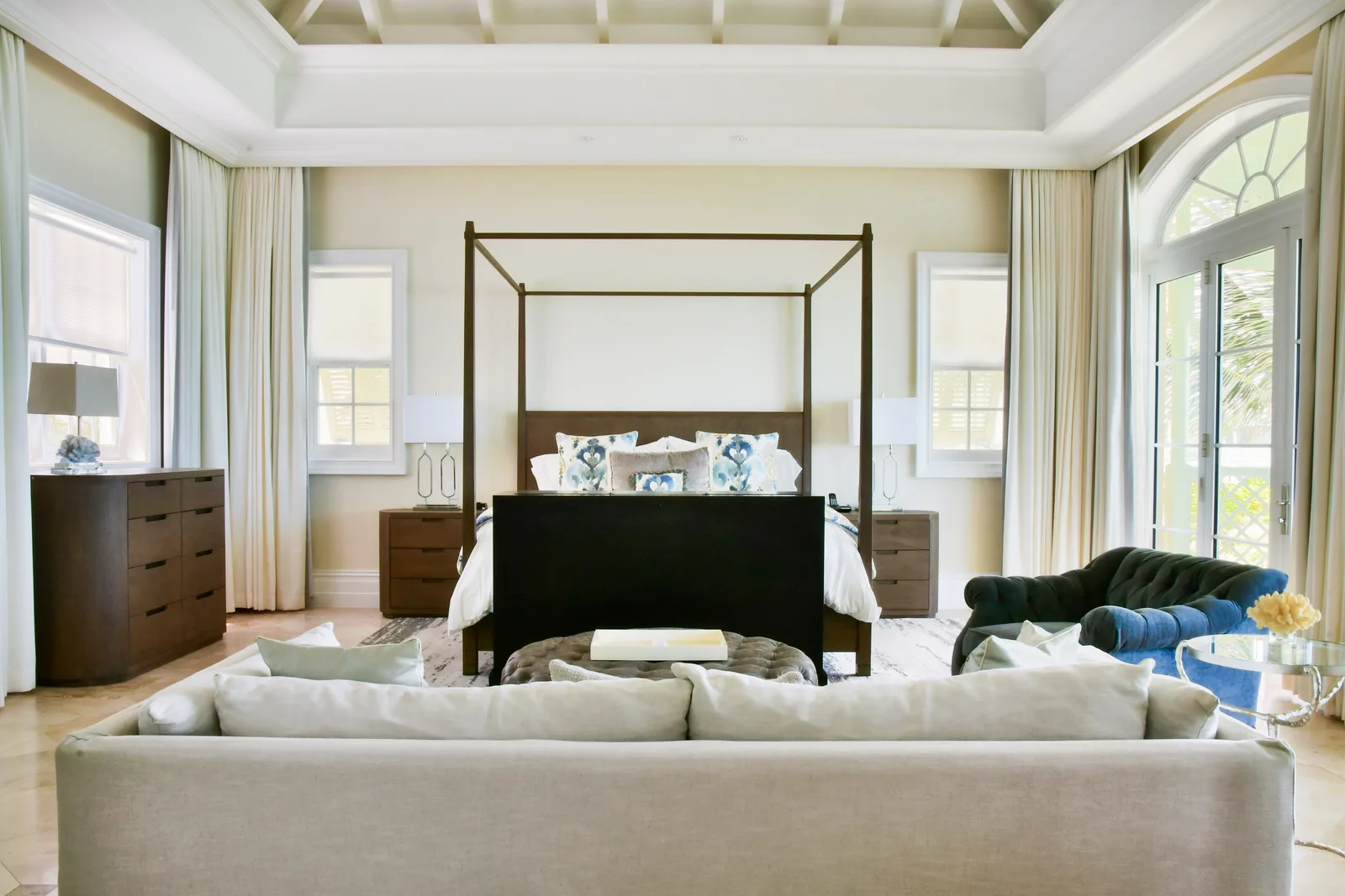The master suite with its four-poster bed and sitting area