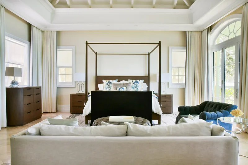 The master suite with its four-poster bed and sitting area
