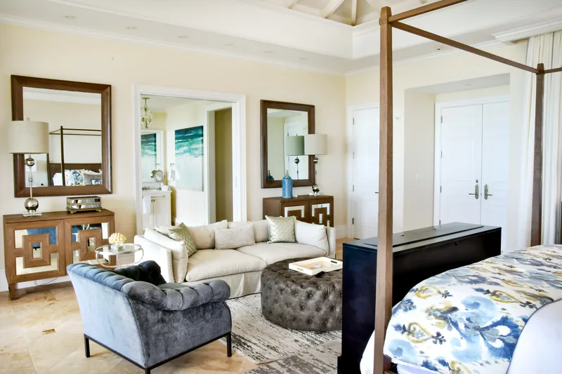 The master suite's sitting area and four-poster bed