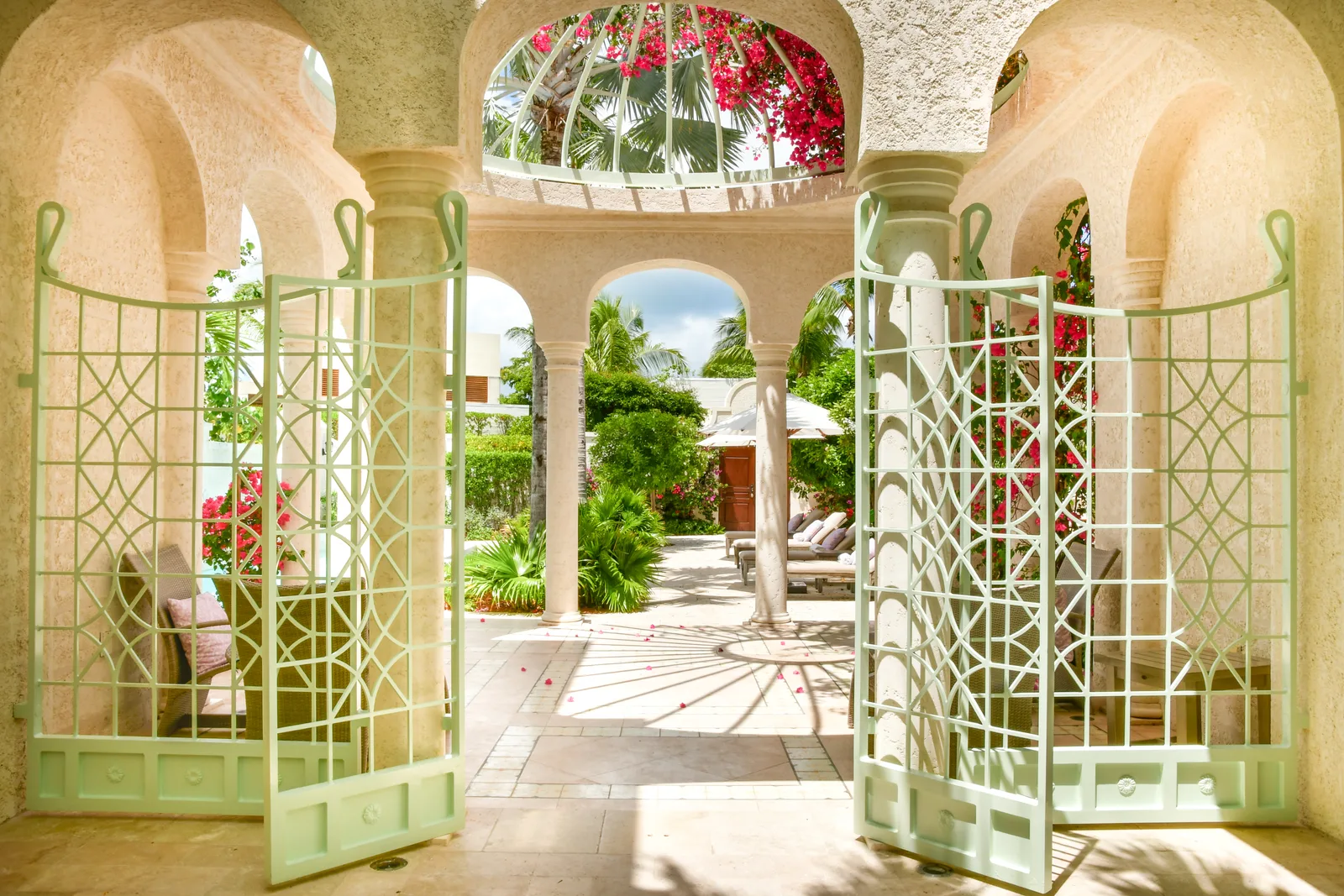 The courtyard gate, open on the arcades